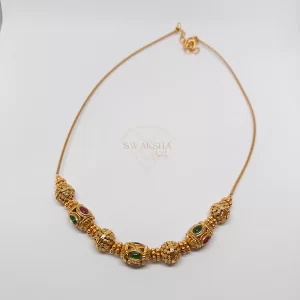 Gold-Tone Beaded Necklace with Ruby & Emerald Accents – Swaksha Jewels